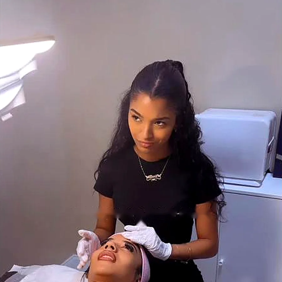Alanii giving a facial